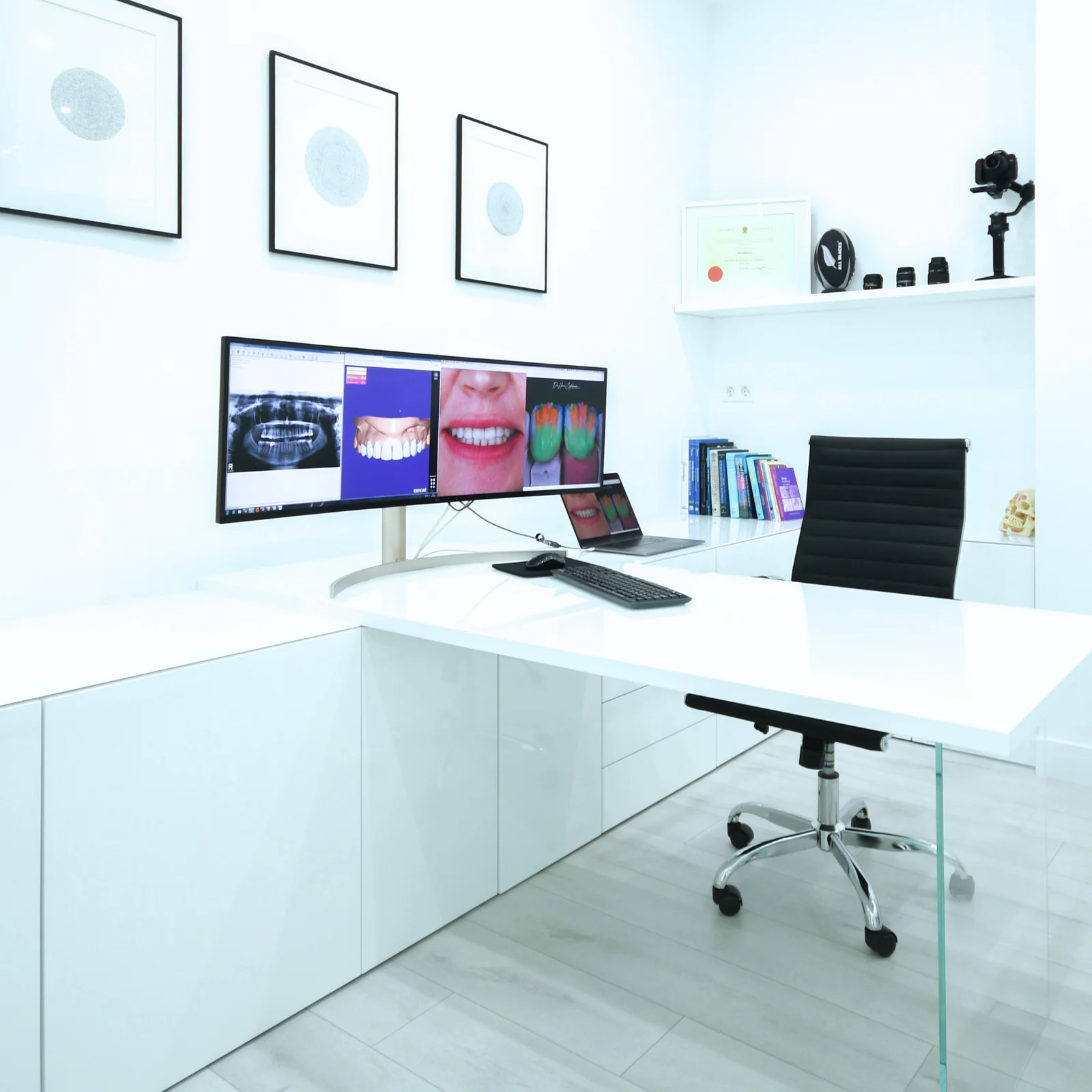 R&H Dental consultation room with digital smile and X-ray displays