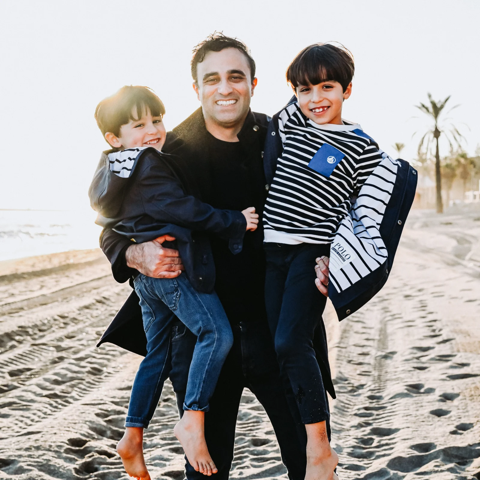 Dr Hami Eghdamian with children in Marbella